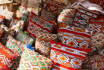 Moroccan cushions in a street shop in medina souk