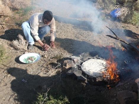 bread-cooking-on-rocks-with-fire